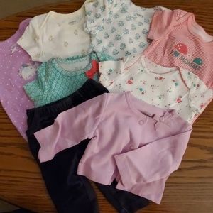 6 onesies, 1 sweater, and 1 pair of jeans